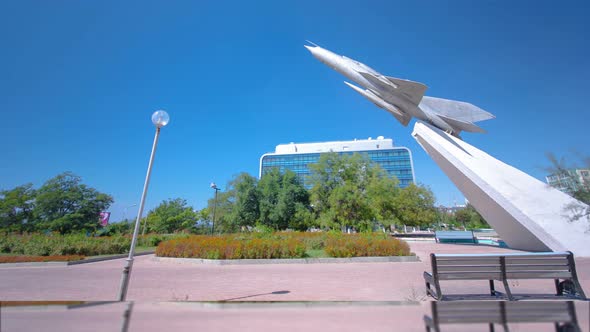 The MIG-21 Plane Is a Monument in the Square of Glory Timelapse Hyperlapse. Aktau, Kazakhstan