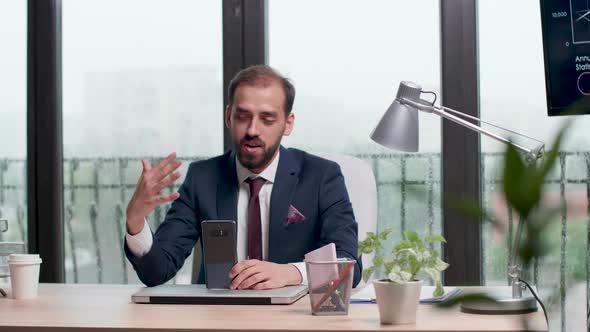 Corporate Worker Uses His Phone To Have a Video Call