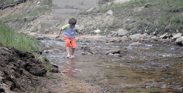 Child Playing By The River 2