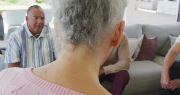 Senior diverse people at meeting talking at retirement home