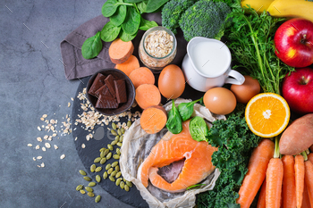  relieving food, clean eating diet. Assortment of healthy ingredients rich in vitamin d, a, beta-carotene, magnesium for cooking on a kitchen table.