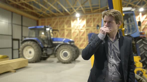 Young Handsome Businessman Thinking Inside Wooden Construction Site