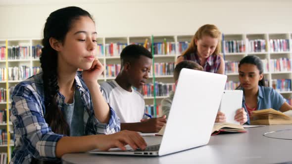 Schoolkids studying in library 4k