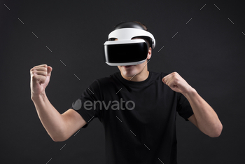 Man with VR playing boxing game entertainment technology