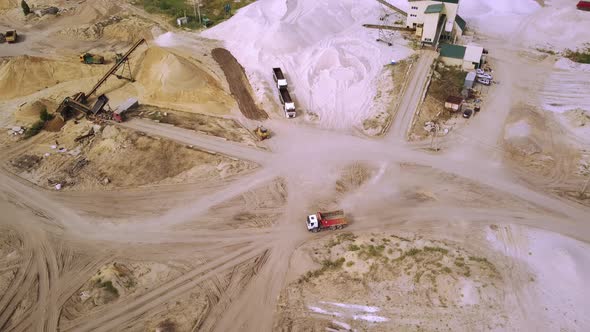 The Truck is Driving Through a Sand Quarry