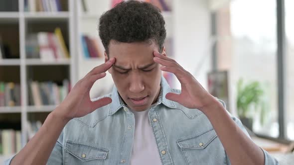 Young African American Man Having Pain in Head Headache