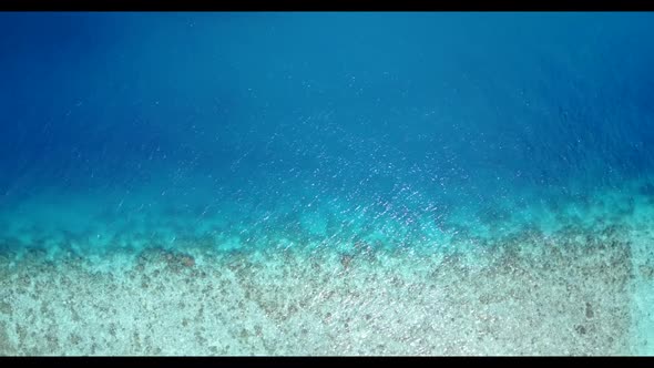 Aerial texture of marine lagoon beach holiday by blue sea and clean sandy background of a dayout bef