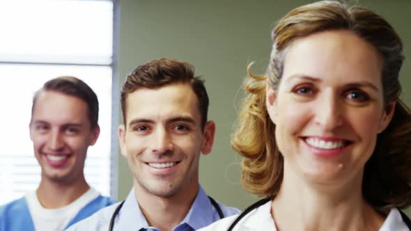 Portrait of doctors and nurse standing in hospital