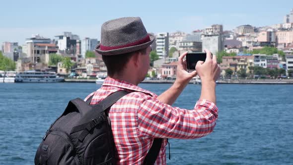 Tourist Man Holding Smartphone and Talking Video of Touristic Places Outdoor Student Travel Blogger