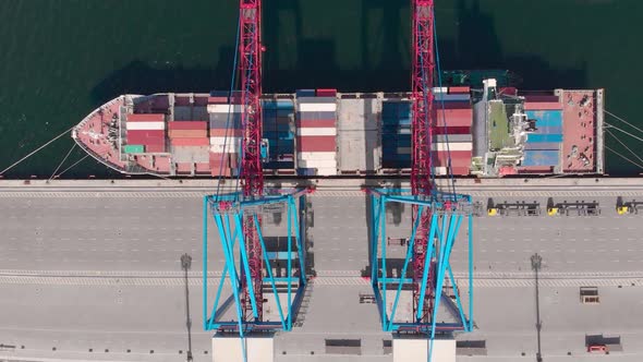 Drone Flying Over a Container Ship During Cargo Operations Over the Customs Area