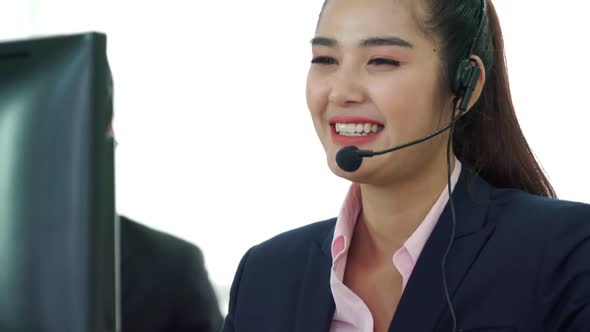 Business People Wearing Headset Working in Office