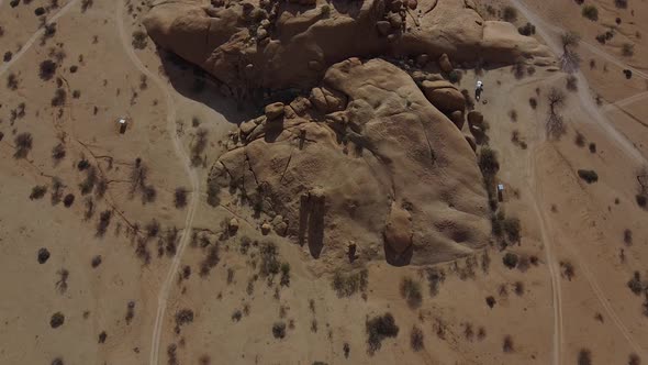 Top view on the huge round rocks in the desert with cats near them, Namibia