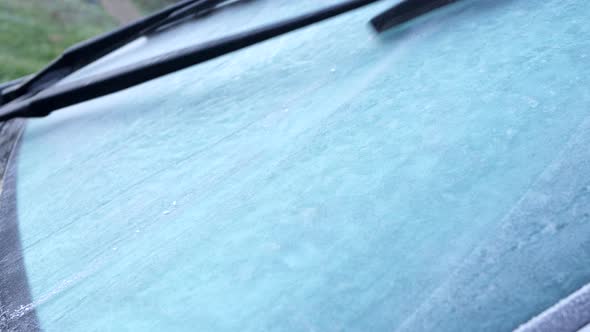 Ice on the windscreen of a vehicle in the morning.
