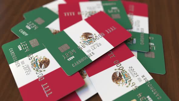 Pile of Credit Cards with Flag of Mexico alt