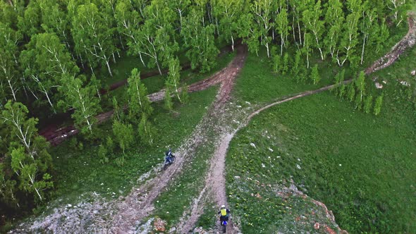 Top View of Two Enduro Motorcycles Riding on a Mountain Road