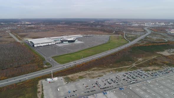 A building for conferences, exhibitions, concerts with and highway with cars 03