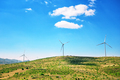 Wind generators on a plain under a blue sky - PhotoDune Item for Sale
