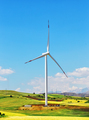 Wind turbine on hill against blue sky - PhotoDune Item for Sale