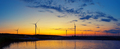 Wind generators power plant on lake at sunset - PhotoDune Item for Sale
