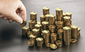 Rich man stacking golden money coins. Income saving plan. - PhotoDune Item for Sale