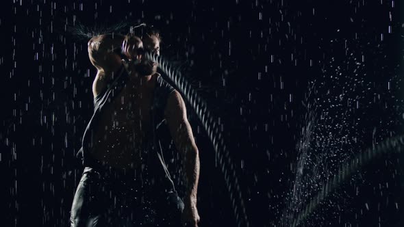 Athletic Man Working Out In The Rain