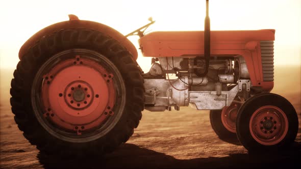 Vintage Retro Tractor on a Farm in Desert