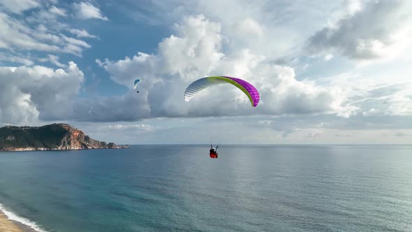 Aerial view 4 K Parachute jumper flying over beautiful Alanya