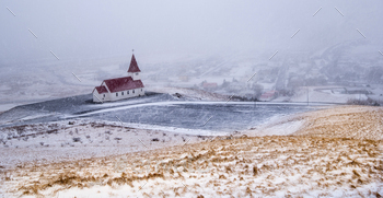 the hill during heavy snow at the village of Vik in Iceland in winter.