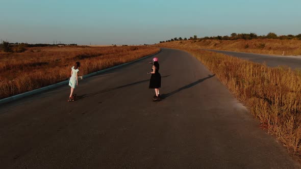 Summertime Activities, Young Ladies Wearing Sundresses Are Longboarding, 