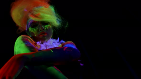 Green Red and Yellow Glowing Paints on Woman Lady is Dancing Slowly in Darkness