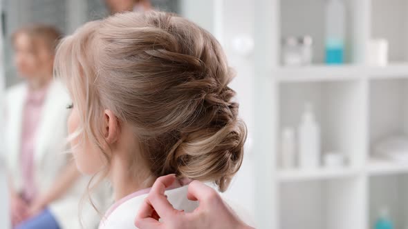 Female Stylist Hands Applying Hairspray Fixing Plaiting Hairstyle