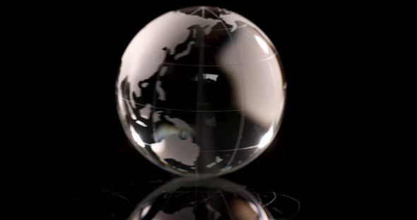 Glass Globe with World Map Spinning on Black Background  Movie