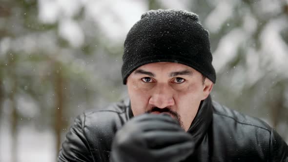 Fighting Single Combat Workout in Forest in Winter Day Adult Man in Black Clothes is Punching Air