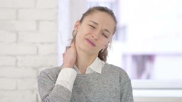 Portrait of Stressed Young Latin Woman Having Neck Pain