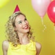 Young woman in party hat and floating balloons - VideoHive Item for Sale