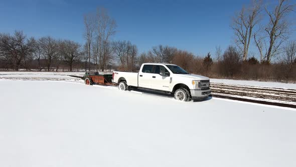 White Truck With Manure Spreader On Fields Thickly Covered With Snow In Southeast Michigan - Fertili
