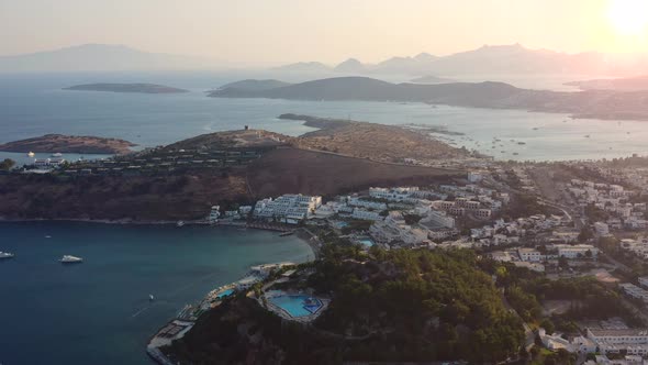 Aerial landscape of white villa homes in the mountain hills of Bodrum Mugla Turkey during a sunset a