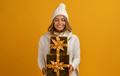 young smiling woman holding golden present boxes celebrating new year, christmas gifts - PhotoDune Item for Sale