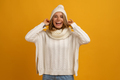 young smiling happy pretty blond woman wearing white knitted sweater, scarf and hat - PhotoDune Item for Sale