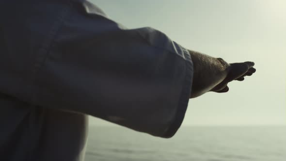 Closeup Man Hands Training Karate Techniques on Sunset