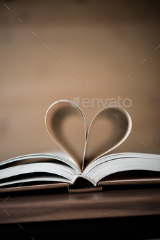 Pages of a book forming the shape of the heart. Love concept.