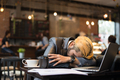 Tired businessman cup take a nap at cafe while working with his laptop. - PhotoDune Item for Sale