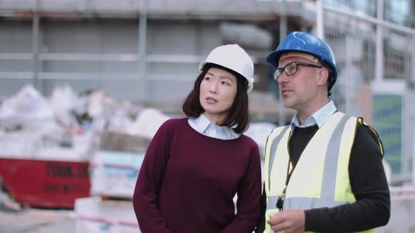 Construction workers looking at project development