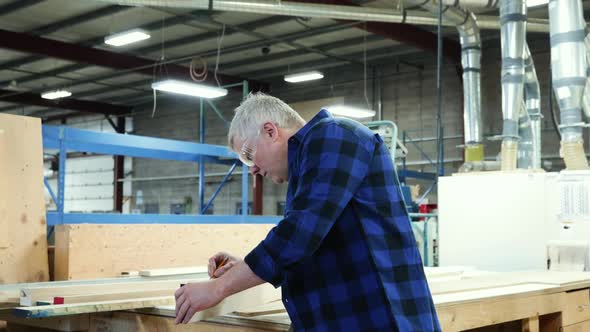 Carpenter at work in woodshop