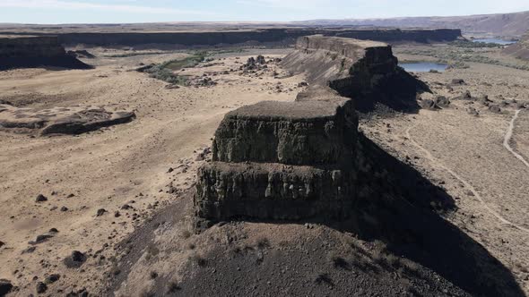 Panoramic aerial orbit of a towering butte, Sun Lakes-Dry Falls State Park, Washington