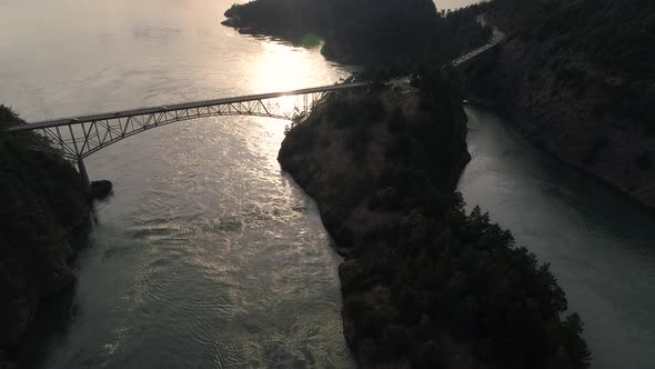 Amazing Lighting In Aerial Of Bridge Crossing Ocean Islands In Pacific Northwest