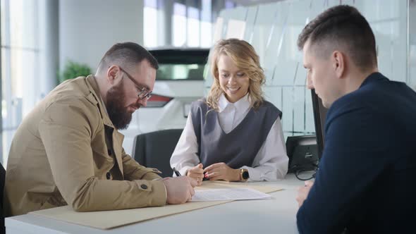 A Married Couple Signs a Contract for the Sale of a New Car