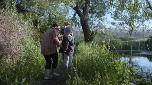 Caring for Grandparents, Small Handsome Attractive Boy Paddle Spending Time with His Elderly Parents