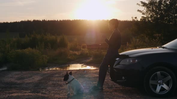 Girl and Dog Traveling By Car