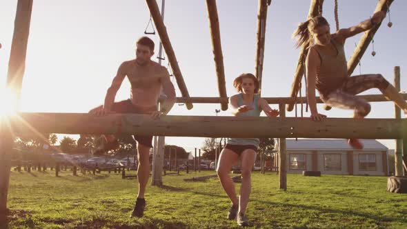 Young adults training at an outdoor gym bootcamp